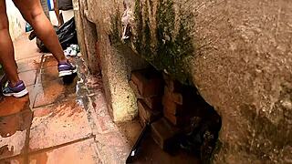 The beggar shows her chest in exchange for cans in this reality segment.