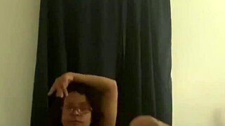 mature latina striptease in glasses undressing slowly