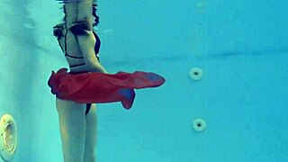 Marfa, the cute russian pornstar, strips naked in the pool for an underwater adventure.