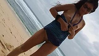 i'm doing yoga on the wild beach with my pink butt plug, no panties on, naked and close-up