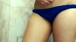 Store curing Asian fat chick with large tits masturbating in the shower