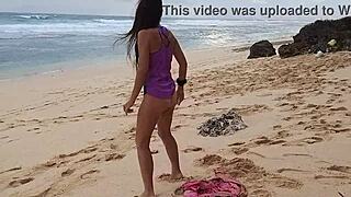 i'm doing yoga on the wild beach with my pink butt plug, no panties on, naked and close-up