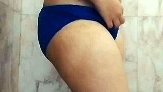 Store curing Asian fat chick with large tits masturbating in the shower