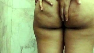 Store curing Asian fat chick with large tits masturbating in the shower