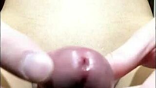 Young Japanese guy stroking his smooth cock solo