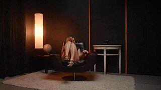 She performs a striptease, ripping clothes to reveal her hairy pussy.