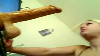 dude, this blonde deepthroats a huge dildo like crazy! 😲