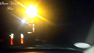 Sucking and jerking the cock to the car crane assistant while husband watches nearby.