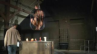 Painful pussy whipping meets deepthroat bondage in bdsm slave session. What’s hiding behind those bound big tits?