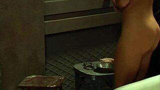 Sensual feminist BDSM scene of a submissive young woman to a boss–authority woman who washes her