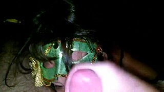 check out this milf in green mask sucking thick cock 😍