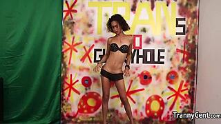 Skinny transsexual tgirl in crossdressing plays with multiple cocks