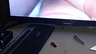 masturbating while watching homemade hardcore fucking video.
