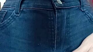 Playing with a belt in a spanking session