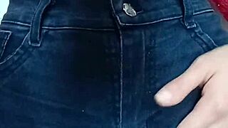 Playing with a belt in a spanking session