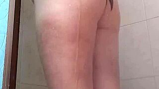 she looks so sexy standing in the shower, water dripping down her body