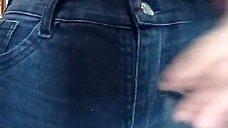 Playing with a belt in a spanking session