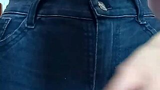 Playing with a belt in a spanking session