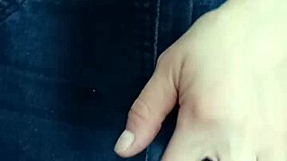 Playing with a belt in a spanking session