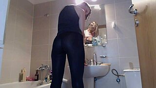 Blonde teases with ass in bathroom leggings