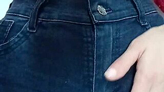 Playing with a belt in a spanking session