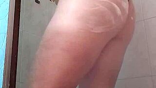 she looks so sexy standing in the shower, water dripping down her body