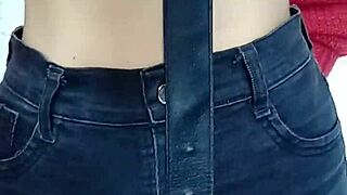 Playing with a belt in a spanking session