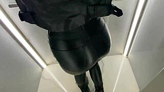 Blonde flashes fake tits in public elevator before cumming