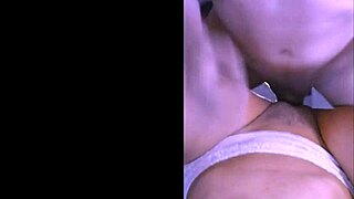 Stressed university student receives relaxing massage from roommate