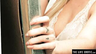 hot blonde in lingerie fondles big tits while masturbating