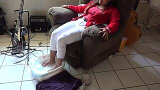 asian beauty teases with wet feet in a steamy foot bath session.