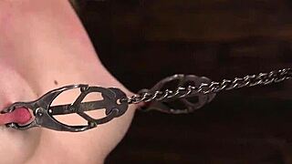 clamped bondage beauty played with dildo while in chains