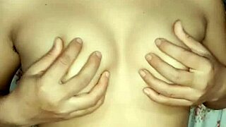 Alinablonde plays solo, pressing her boobs until she squirts