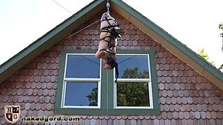 This BDSM slavegirl is tied with straps and a ballgag