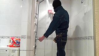 The Master In Blue Jeans Washes Barefoot In The Wet Bath