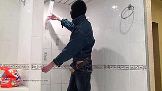 The Master In Blue Jeans Washes Barefoot In The Wet Bath