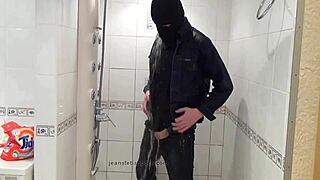 The Master In Blue Jeans Washes Barefoot In The Wet Bath