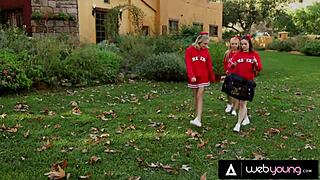 Ariana Marie dominates the cheerleader squad with Dakota Skye outdoors.