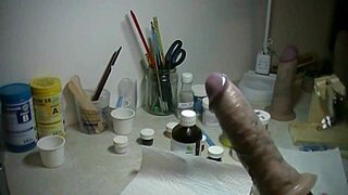 painting a prosthetic penis in an artistic way