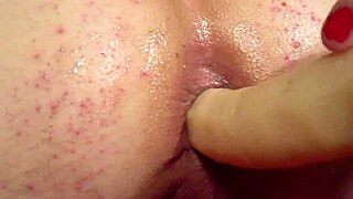 elly uses a dildo from behind in this scene