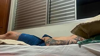 Amateur Tattooed Soloboy Engages in Intense Self-Masturbation Session with Detailed Strokes and Climax