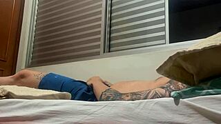 Amateur Tattooed Soloboy Engages in Intense Self-Masturbation Session with Detailed Strokes and Climax