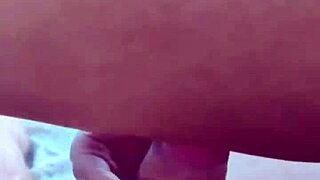 Full-breasted girl receives facial while sitting tight.