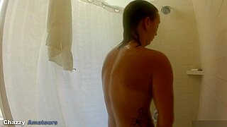 Nicci Taylor steps into the shower. Hidden camera captures her nude bathing.