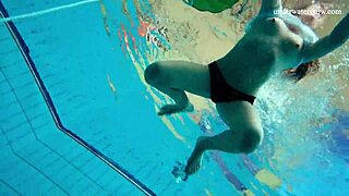 Horny teen strips naked underwater fast