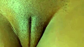 A narrow sleeved, dyed-haired teen with huge labia rubs her pussy to an erection