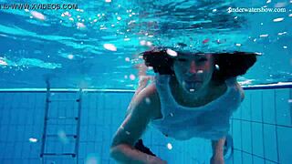 Horny teen strips naked underwater fast