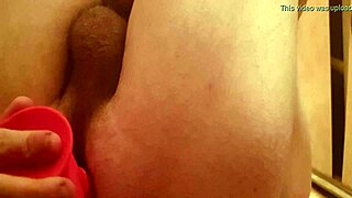 guy teases his ass with dildo in bath