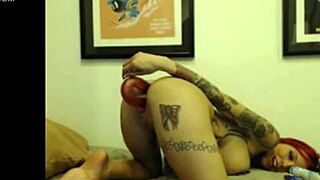 Tattooed cam girl works her dildo deep into her pussy and tight ass
