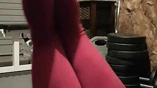 Gym girl performs striptease.